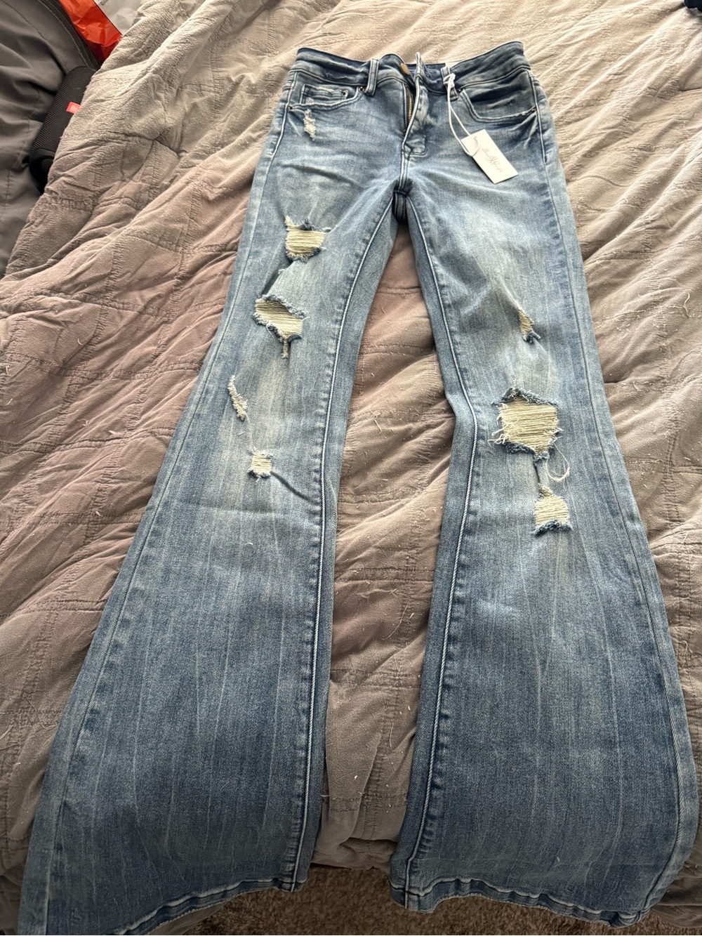 Women's Distressed Light Blue Flared Jeans